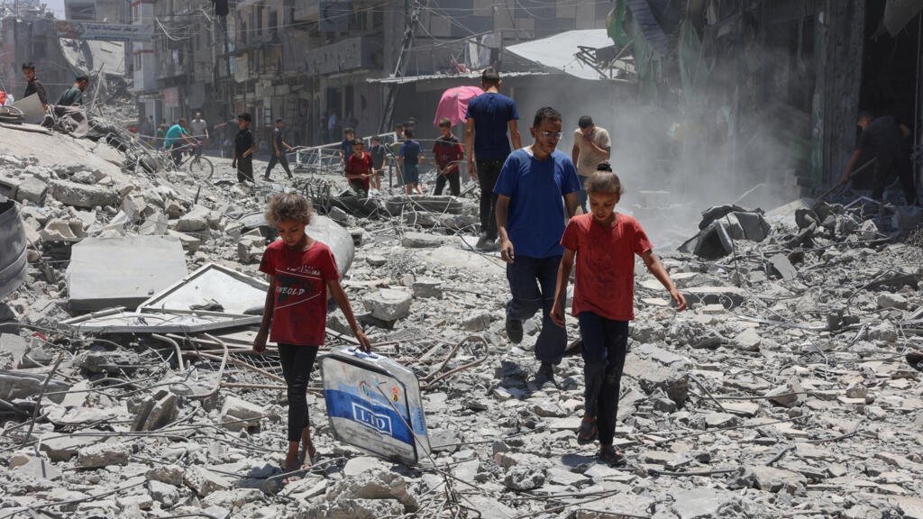 Crush at Gaza aid site kills at least 20 Palestinians as Israeli strikes kill 41 more