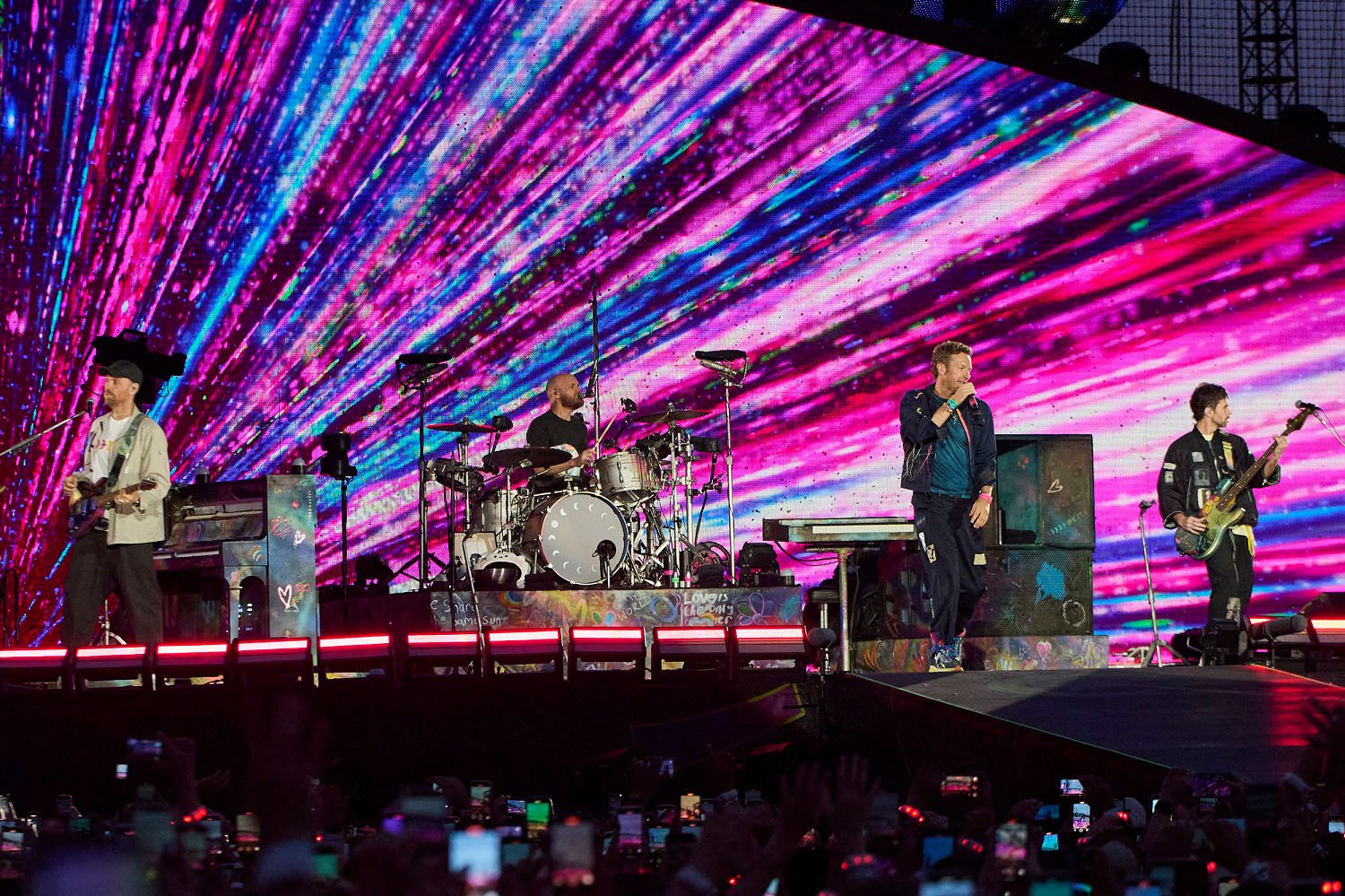 Chris Martin jokes couple is ‘having an affair’ at Coldplay concert after man ducks on kiss cam